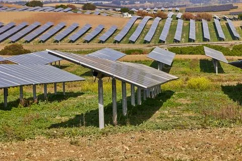 Electrical power plant with rows of solar panels for producing clean ecolog.. Stock Photos
