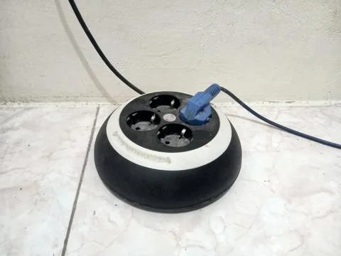 Electrical Power Strip with Plug on Tiled Floor Stock Photos