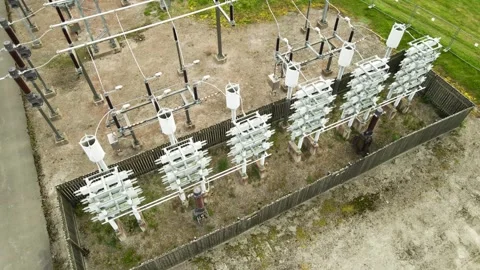Electrical Power Substation With High Voltage Insulators and Transformers Stock Footage 338026552