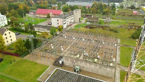 Electrical power substation with transformers and high voltage cables Video stock 348124426
