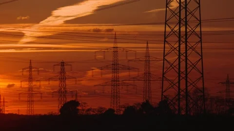 Electrical power supply (electrical towers) with a sunset and red sky Stock Footage 62853323