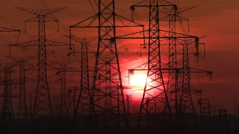 Electrical power transmission grid with red sunset and power lines Vídeos de archivo 149384597