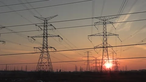 Electrical power transmission grid with red sunset and power lines Vídeos de archivo 149384779