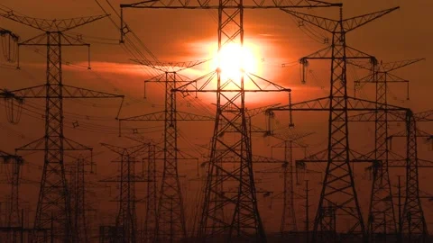 Electrical power transmission grid with red sunset and power lines Video stock 149385106