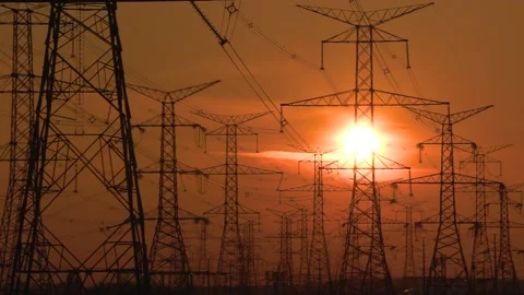 Electrical power transmission grid with red sunset and power lines Stock-Footage 149385161