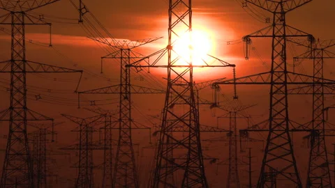 Electrical power transmission grid towers and lines with red sky and sun Stock Footage 149629002