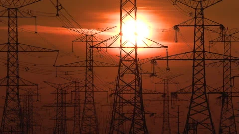 Electrical power transmission grid towers and lines with red sky and sun 動画素材 149629304