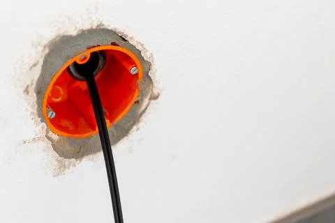 Electrical socket box with cable during home renovation Stock Photos