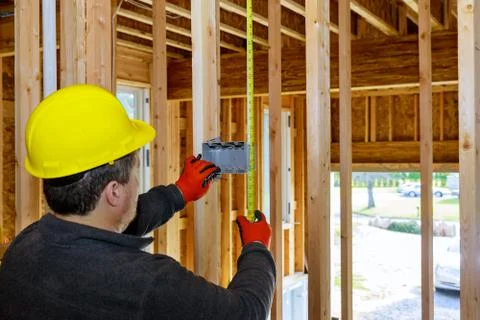 Electrical socket boxes inside frame house with basic electrical wiring 스톡 사진