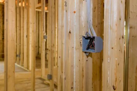 Electrical socket boxes inside frame house with basic electrical wiring 스톡 사진