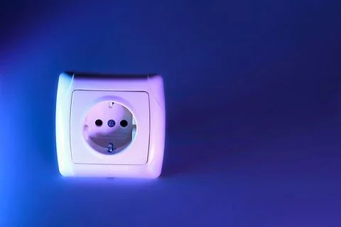 Electrical socket for connecting devices on blue Stock Photos