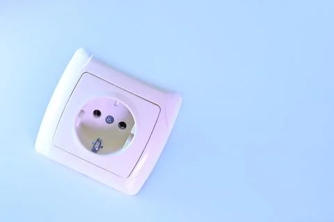 Electrical socket for connecting devices in pale blue light Stock Photos