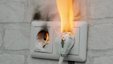 Electrical socket on fire in house on wall Stock Footage 246317756
