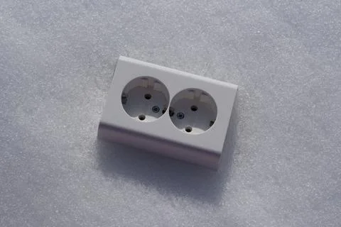 Electrical socket on the snow close-up. Stock Photos