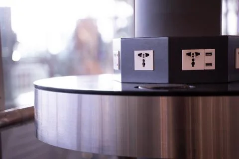 Electrical socket with three receptacles installed on the pole of the hall .. Stock Photos