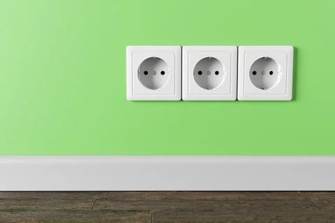 An electrical socket in the wall in the apartment of the house. Stock Photos