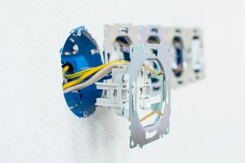 Electrical sockets in a white wall Stock Photos