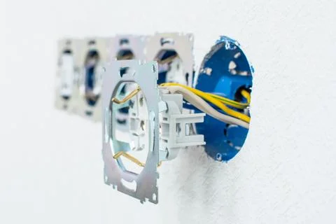 Electrical sockets in a white wall Stock Photos