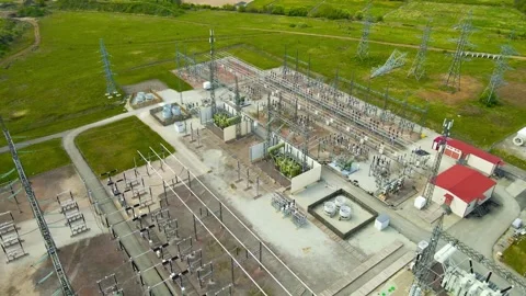 Electrical Substation Aerial View Showing High Voltage Transformers and Pylons Stock Footage 336071201