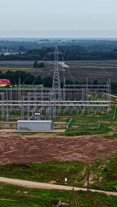 Electrical Substation and Transmission Tower Aerial View over Farmland Stock Footage 341546064