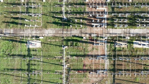 Electrical substation - grid of high voltage power lines and wires Stock Footage 141548170