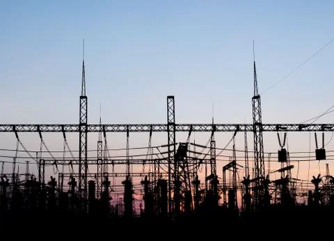 Electrical substation silhouette on the dramatic sunset background. Stock-Fotos