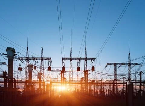 Electrical substation silhouette on the dramatic sunset background Stockfoto's