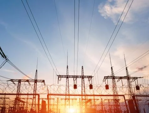 Electrical substation silhouette on the dramatic sunset background Photos