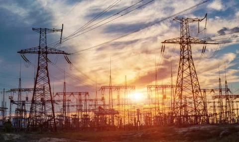 Electrical substation silhouette on the dramatic sunset background Stockfoto's