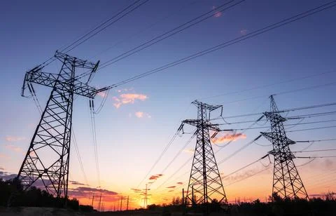 Electrical substation silhouette on the dramatic sunset background Fotos de archivo