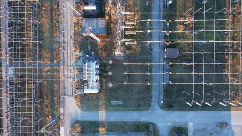 Electrical substation - transformers and a grid of lines and wires Stock Footage 124120633