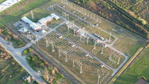 Electrical substation: transformers and grid of pylons, lines and wires. Stock Footage 152050294
