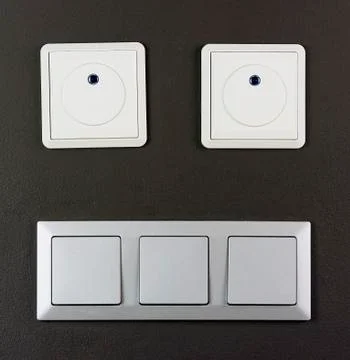 Electrical switch and plug on wall smile face Stock Photos