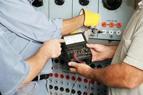 Electrical Team Testing Voltage Foto stock