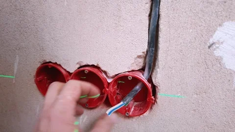 Electrical Technician Carefully Reinstates Wall Wiring Using Laser Equipment Stock Footage 328521901