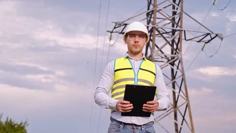 Electrical technician at a power plant. Electrical distribution engineer. Head o Stock Footage 252667378