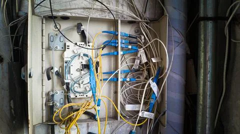 Electrical terminal in junction box open and broken with exposed wires, China Stock Photos
