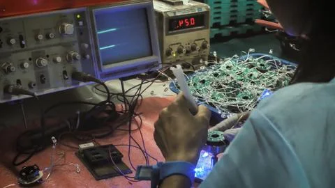 Electrical test of the PCB of computer fans. Stock Photos