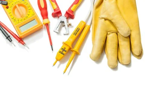 Electrical tester Digital multimeter Wire stripper Insulated leather gloves Stock Photos