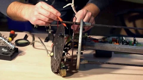 Electrical is testing with voltmeter for repair electronic equipment Stock Footage 69149008