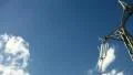 Electrical tower on blue sky (pan) HD Footage