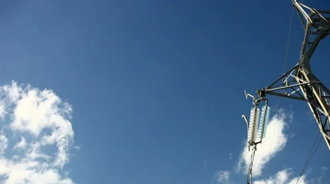 Electrical tower on blue sky (pan) Stock Footage 10899337