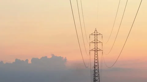 Electrical tower with clouds running on sunset Stock Footage 10863540