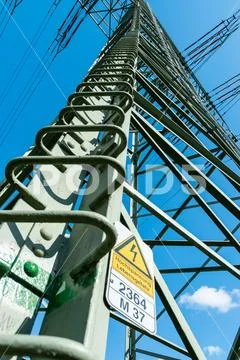 Electrical tower sign warning from danger of high voltage in german Stock Photos