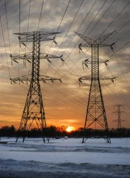 The electrical tower sunset in winter Stock Photos