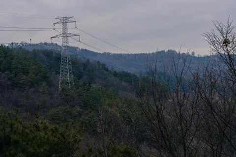 Electrical tower under cloudy sky. Stock Photos
