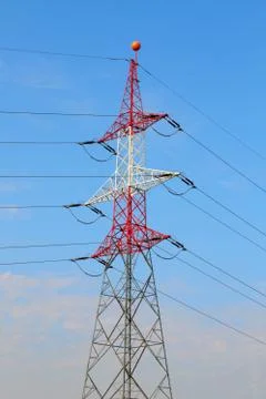 Electrical tower / utility pole / power pole before cloudy blue sky Stock Photos