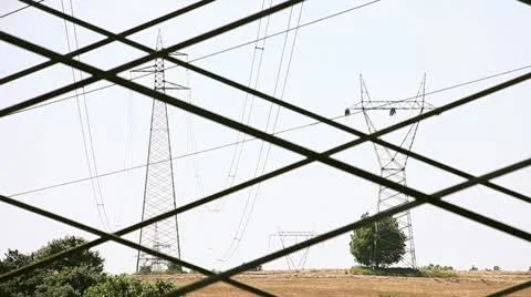 Electrical towers on a filed of wheat Video stock 11680136