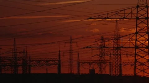 Electrical towers with a sunset in germany Stock Footage 64120068