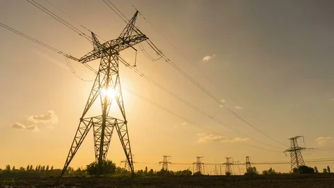 Electrical towers at sunset Time Lapse 4k. Electricity pylons Stock Footage 75381417